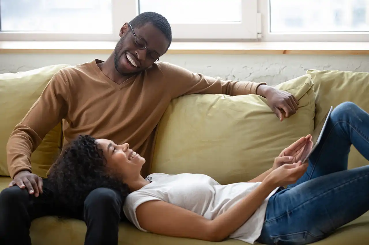 Homeowners reviewing home equity financing options together on a tablet