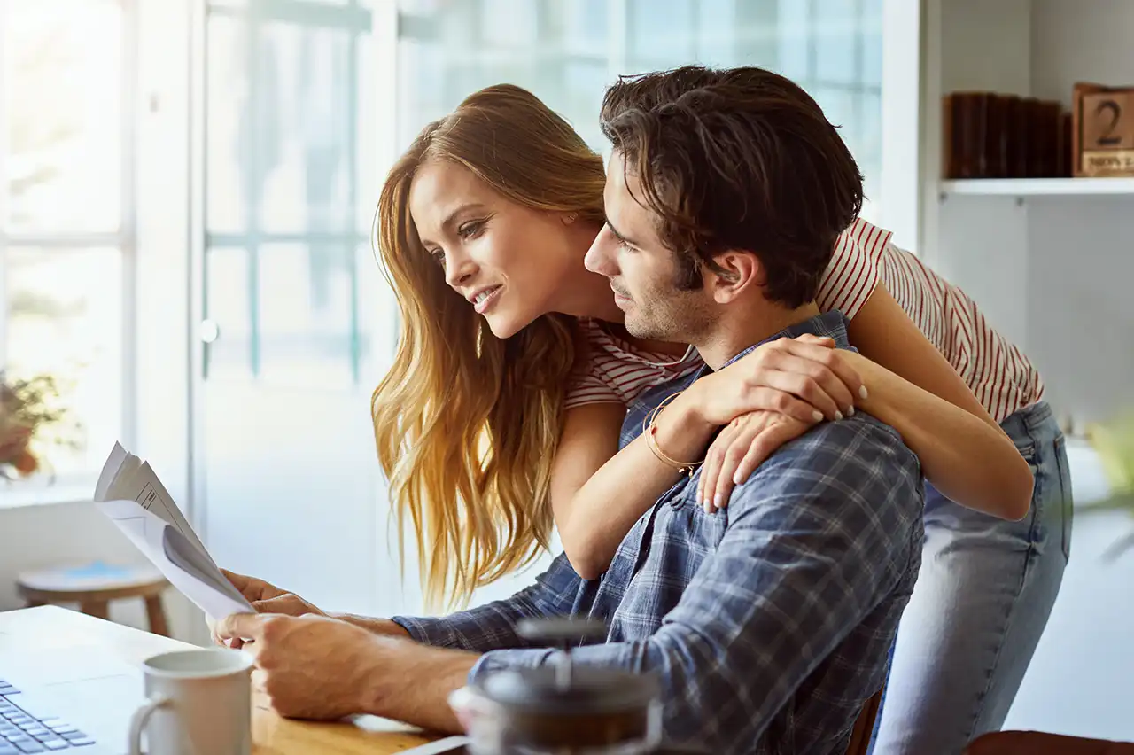 Homeowners reviewing financial information while planning their next home purchase