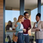 Arizona homeowners touring a potential new home with a real estate professional