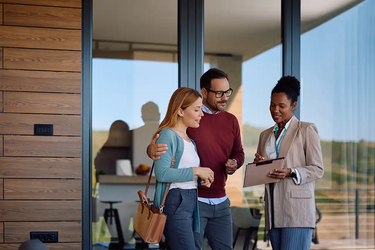 Arizona homeowners touring a potential new home with a real estate professional