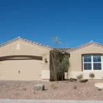Single-story Arizona home with stucco exterior and desert landscaping
